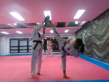 Training friend Johanna Nukari helps me do side kicks.